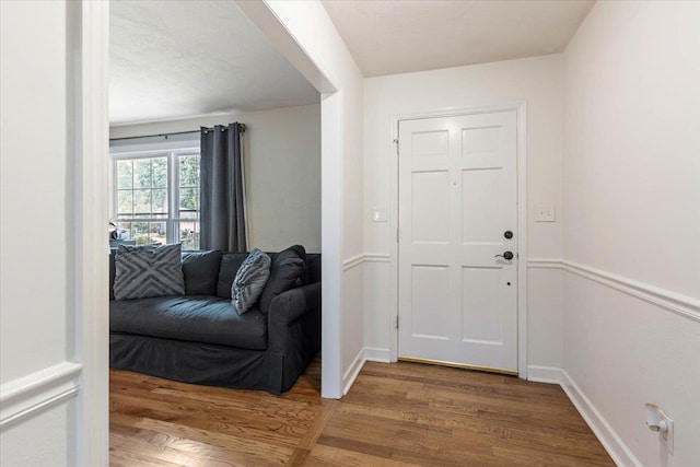 entryway with hardwood / wood-style floors