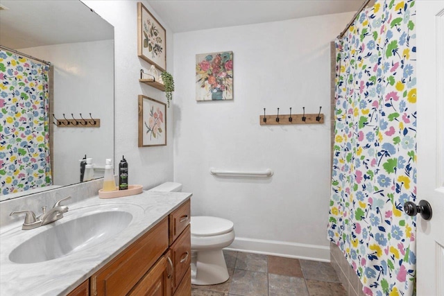 bathroom with walk in shower, vanity, and toilet