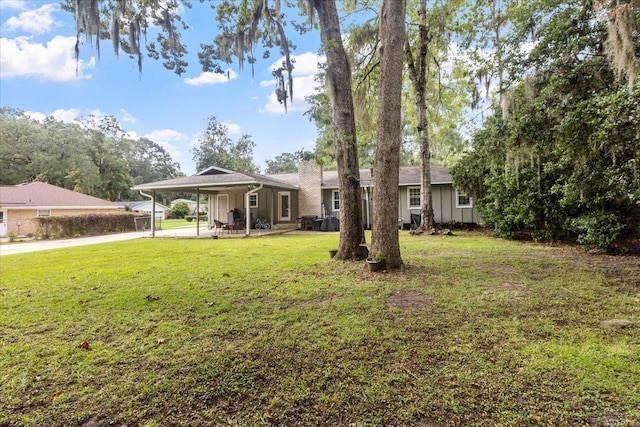 view of yard with a carport