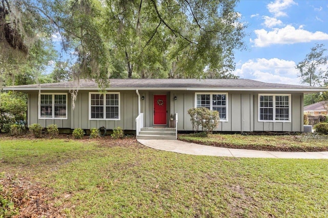 ranch-style house with a front lawn