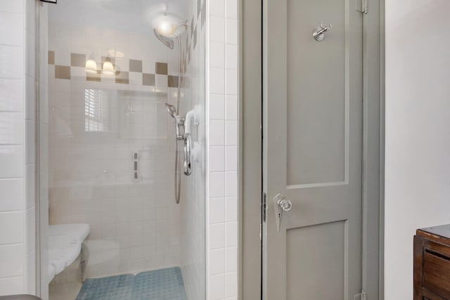 bathroom with a tile shower