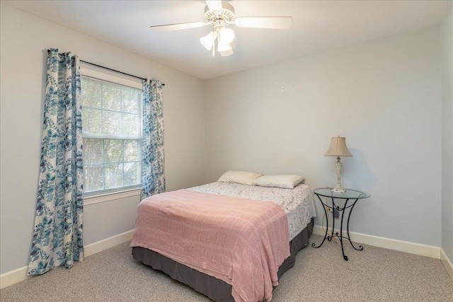 bedroom with carpet floors, ceiling fan, and baseboards