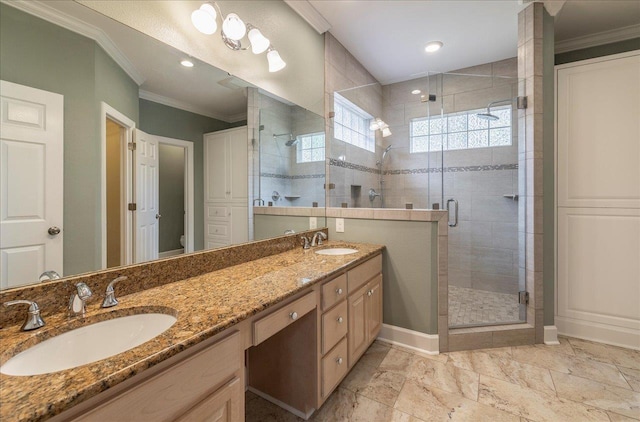 full bath featuring crown molding, a stall shower, and a sink