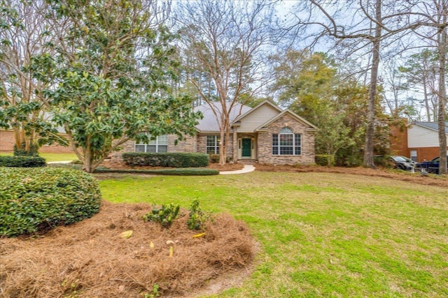 view of front of house featuring brick siding and a front lawn