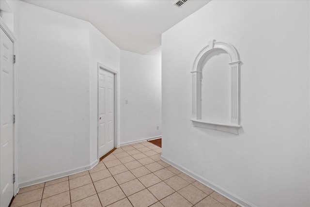 interior space with light tile patterned floors