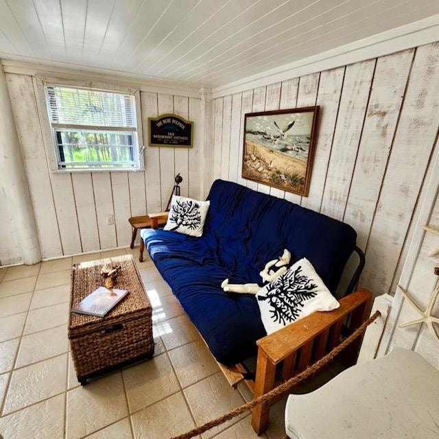 interior space featuring wood ceiling and tile patterned floors