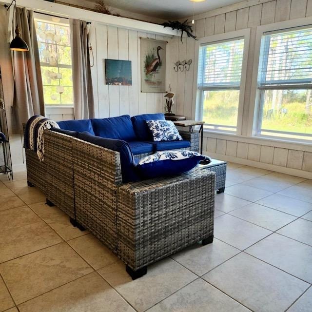 tiled living room with wood walls