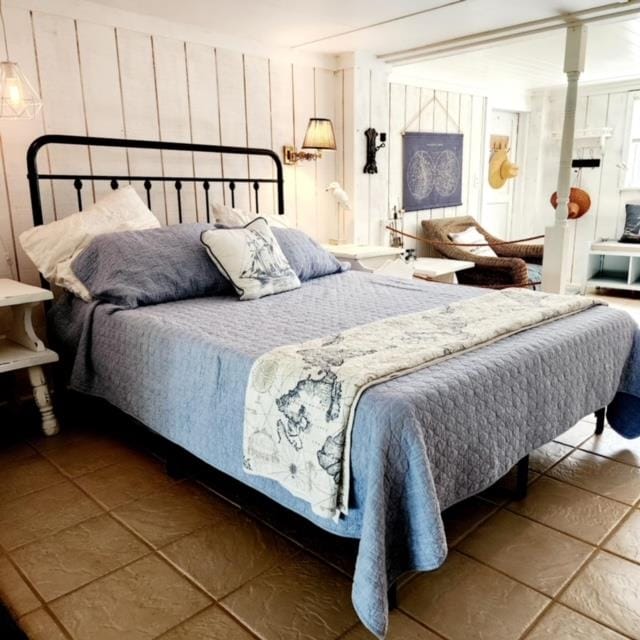 bedroom with tile patterned floors