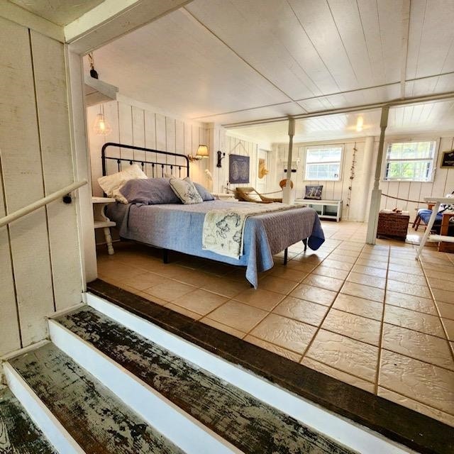 bedroom with light tile patterned floors