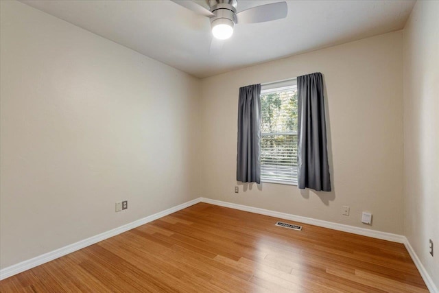 unfurnished room featuring ceiling fan and wood-type flooring