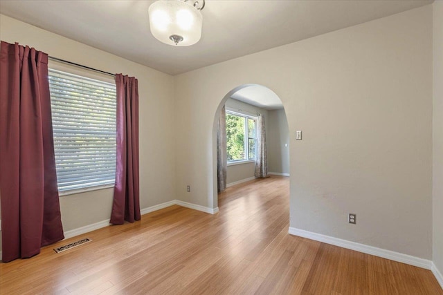 spare room featuring light hardwood / wood-style flooring