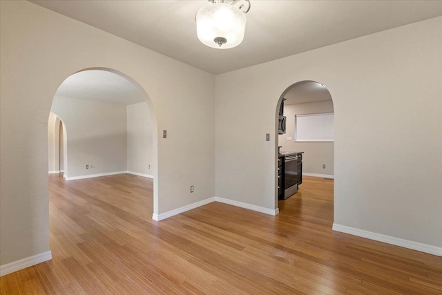 spare room featuring light hardwood / wood-style flooring