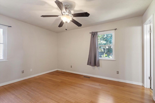 spare room featuring light hardwood / wood-style flooring and ceiling fan