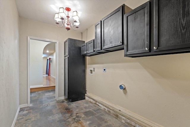 laundry area featuring electric dryer hookup, cabinets, a chandelier, and washer hookup