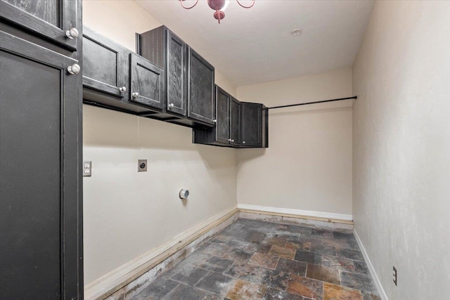 laundry room with cabinets and electric dryer hookup