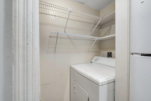 laundry room with laundry area and washer / dryer