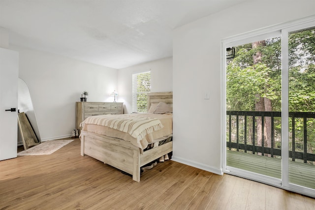 1200 Cross Creek Way Unit 4, Tallahassee, FL 32301 - bedroom with access to exterior and wood finished floors