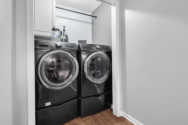 1200 Cross Creek Way Unit 4, Tallahassee, FL 32301 - laundry room with independent washer and dryer, cabinet space, and wood finished floors
