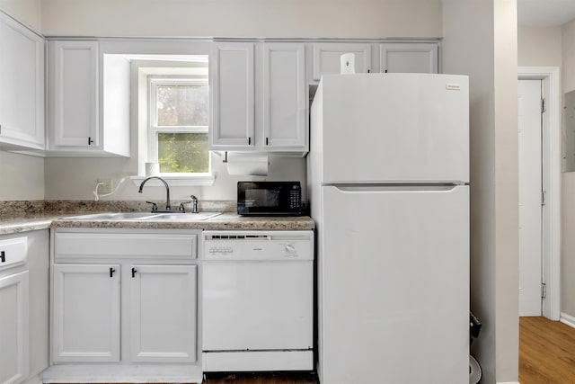 1200 Cross Creek Way Unit 4, Tallahassee, FL 32301 - kitchen with white appliances, white cabinetry, and light countertops