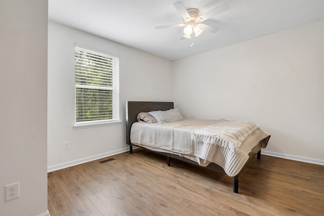 1200 Cross Creek Way Unit 4, Tallahassee, FL 32301 - bedroom with wood finished floors and a ceiling fan
