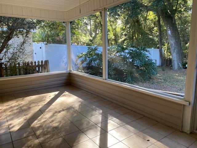 unfurnished sunroom featuring plenty of natural light