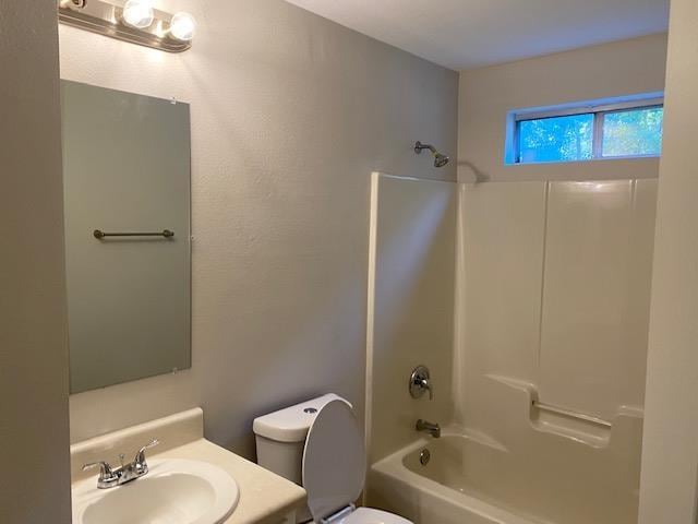 full bathroom with shower / washtub combination, toilet, and vanity