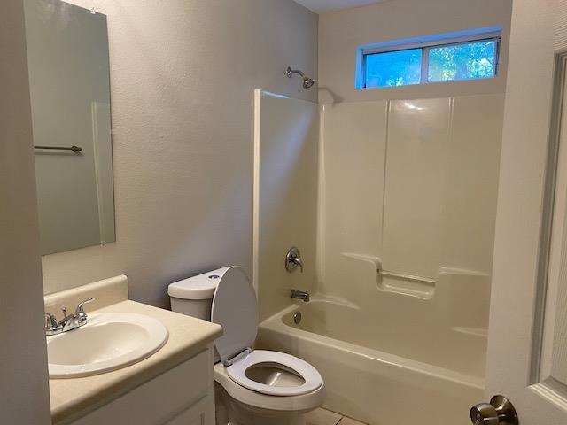 full bathroom with tile patterned floors, vanity, toilet, and bathing tub / shower combination