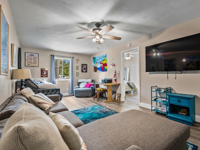 2402 Mexia Ave, Tallahassee, FL 32304 - living room featuring wood finished floors, a ceiling fan, and baseboards