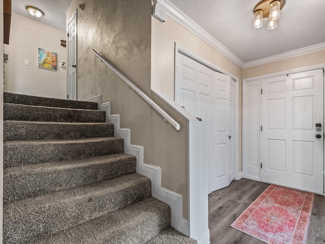 2402 Mexia Ave, Tallahassee, FL 32304 - foyer entrance with wood finished floors, stairs, and crown molding
