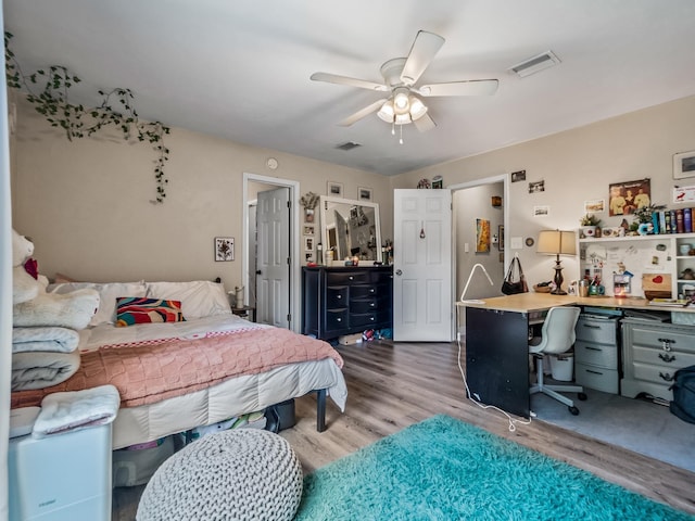 2402 Mexia Ave, Tallahassee, FL 32304 - bedroom with wood finished floors, visible vents, and a ceiling fan