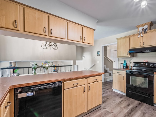 2402 Mexia Ave, Tallahassee, FL 32304 - kitchen with black appliances, light wood finished floors, light brown cabinetry, and under cabinet range hood