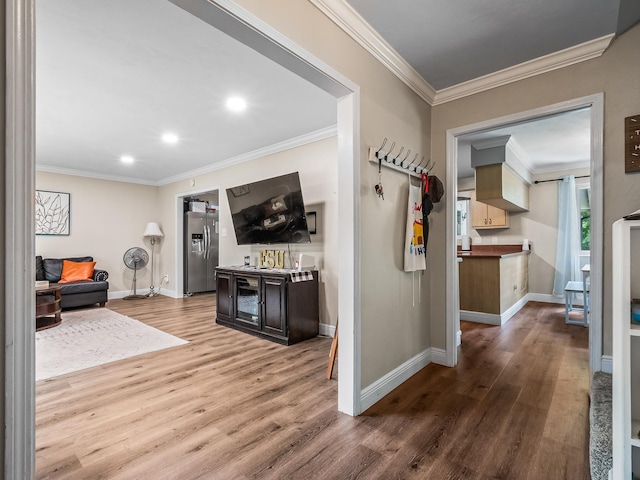 2402 Mexia Ave, Tallahassee, FL 32304 - hall with baseboards, recessed lighting, wood finished floors, and crown molding