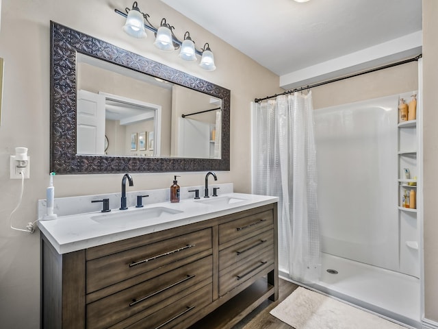 2402 Mexia Ave, Tallahassee, FL 32304 - full bathroom with double vanity, a shower stall, and a sink