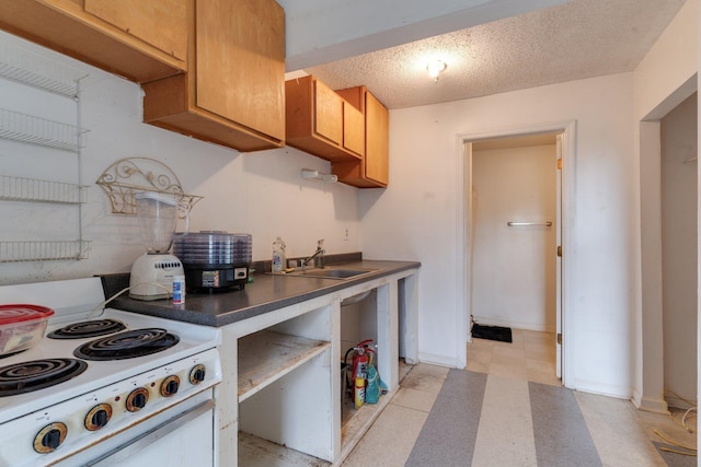 1614 S Meridian St, Tallahassee, FL 32301 - kitchen featuring white range with electric stovetop, a sink, dark countertops, brown cabinetry, and light floors
