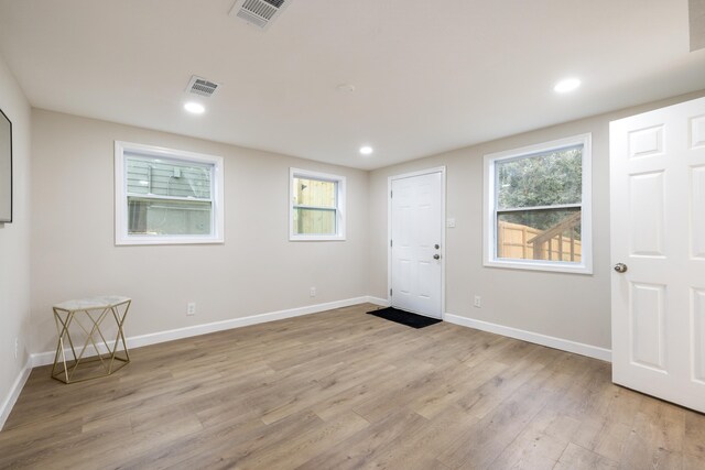 spare room with light wood-type flooring