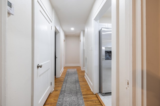 hall featuring light wood-type flooring