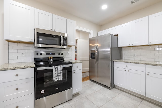 kitchen with white cabinetry and appliances with stainless steel finishes