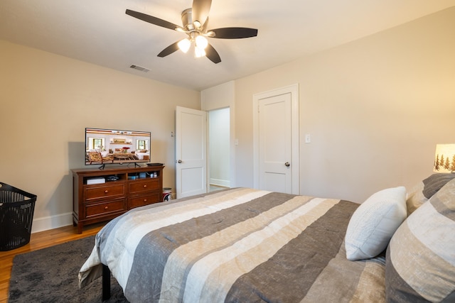 bedroom with hardwood / wood-style flooring and ceiling fan