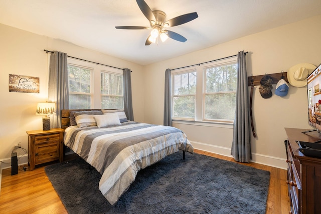 bedroom featuring ceiling fan and light hardwood / wood-style flooring