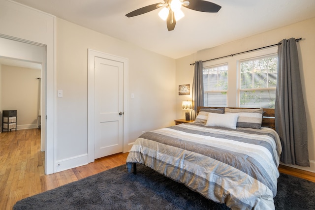 bedroom featuring ceiling fan and light hardwood / wood-style flooring