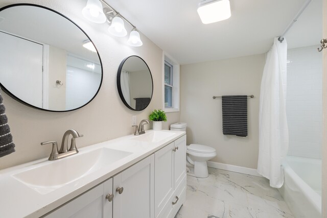 full bathroom with shower / bath combo, vanity, and toilet