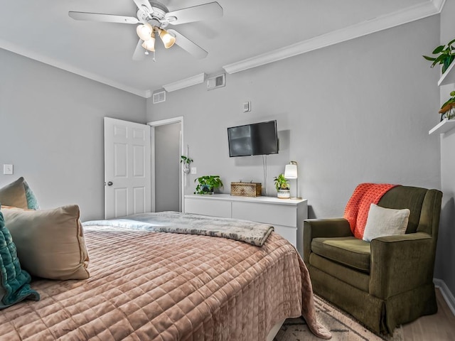 bedroom featuring ornamental molding and ceiling fan