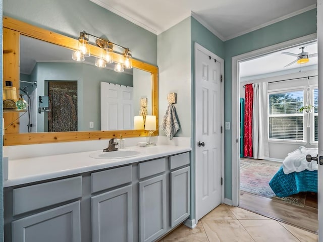 bathroom with ceiling fan, vanity, ornamental molding, a shower with curtain, and tile patterned floors