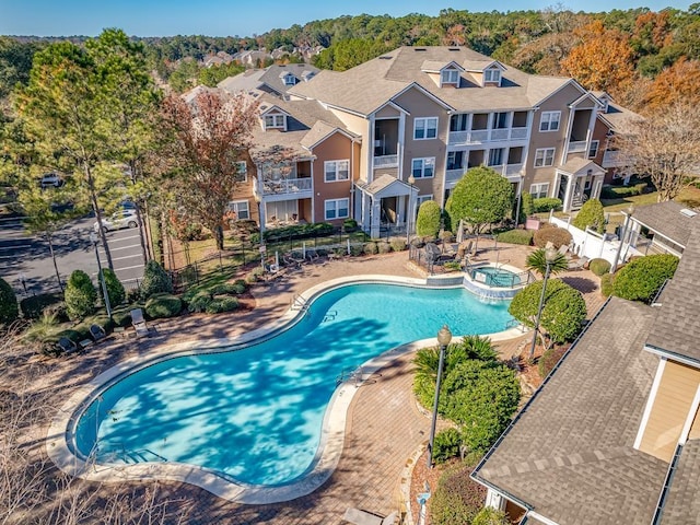 view of pool featuring a hot tub and a patio