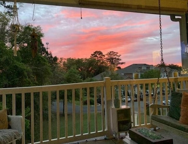 view of balcony at dusk