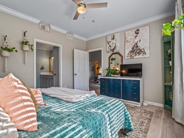 bedroom featuring ceiling fan, ornamental molding, connected bathroom, and light wood-type flooring