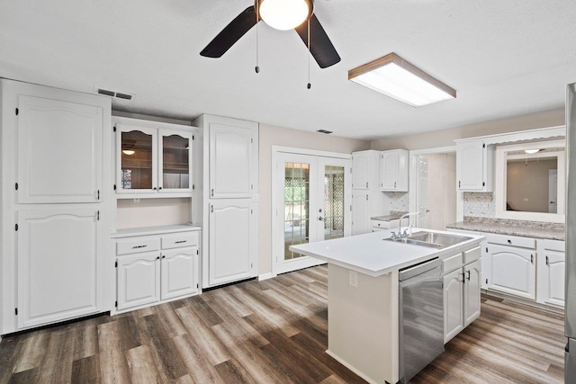 131 Alma Yates St, Quincy, FL 32351 - kitchen with dishwasher, a sink, white cabinetry, french doors, and wood finished floors