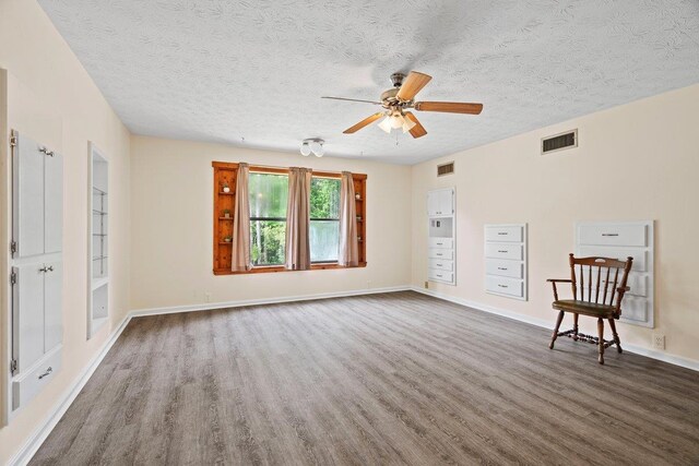 131 Alma Yates St, Quincy, FL 32351 - spare room with wood finished floors, a textured ceiling, ceiling fan, and baseboards