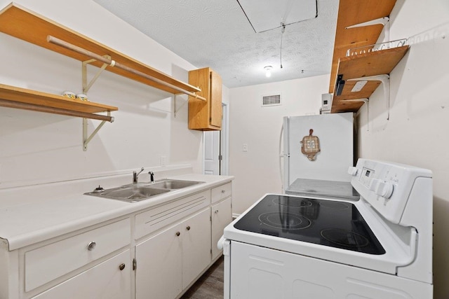 131 Alma Yates St, Quincy, FL 32351 - laundry area with dark wood-style floors, a textured ceiling, and attic access