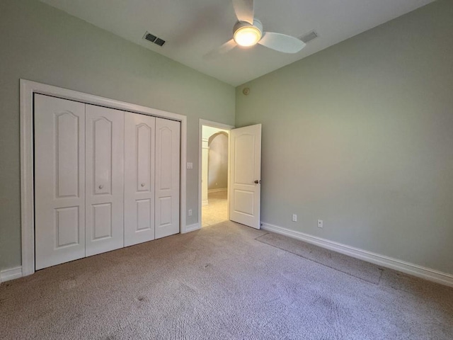 5672 Burnside Cir, Tallahassee, FL 32312 - unfurnished bedroom featuring carpet floors, a closet, a ceiling fan, and arched walkways